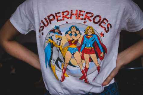 person wearing superheroes printed t shirt